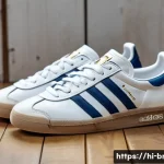 Home 22 아디다스 오리지널스와 나이키 SB 비교 - A stylish close-up shot of Adidas Originals sneakers placed on a vintage wooden floor, highlighting ...